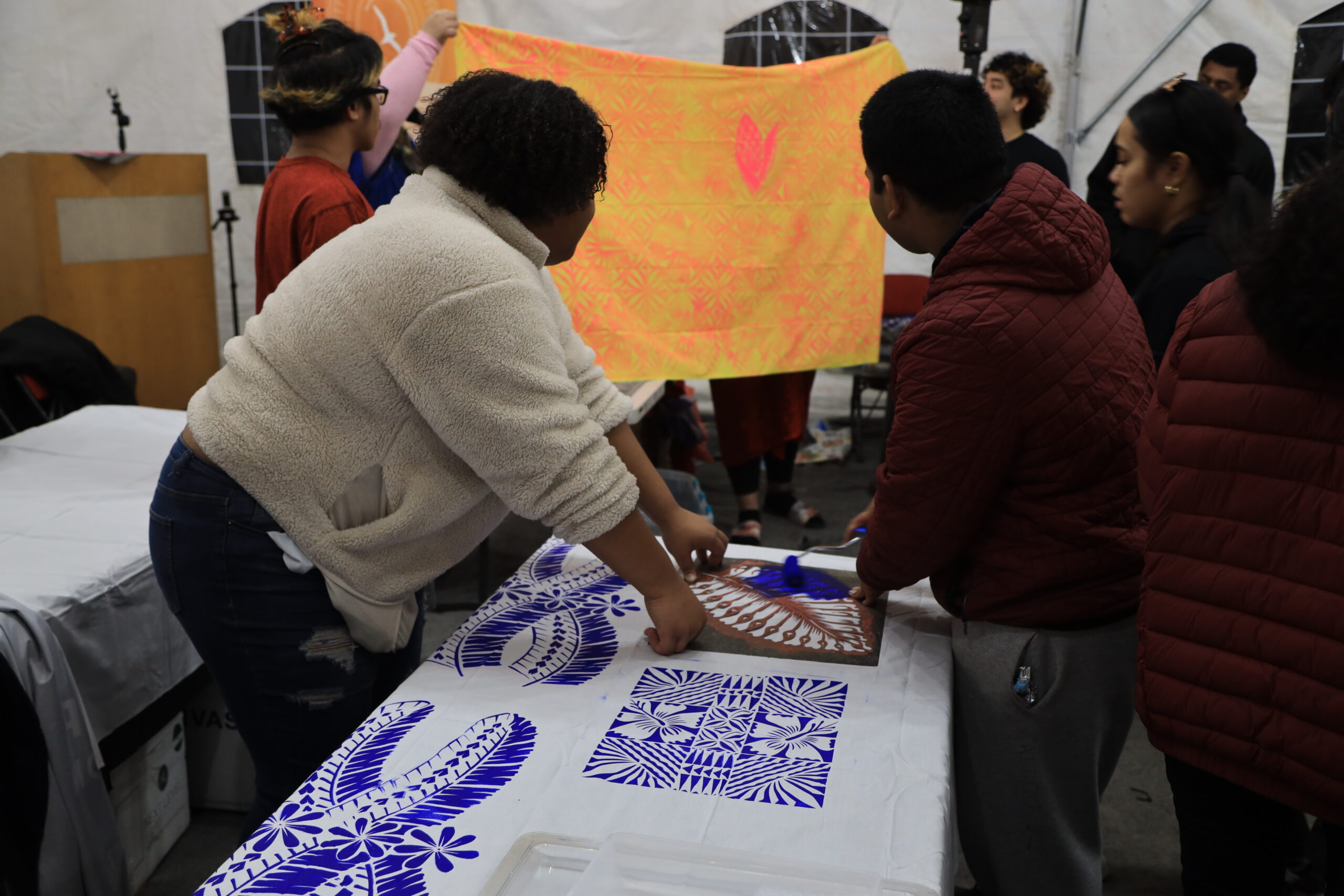 Youth painting with stencils observe a finished i'e.